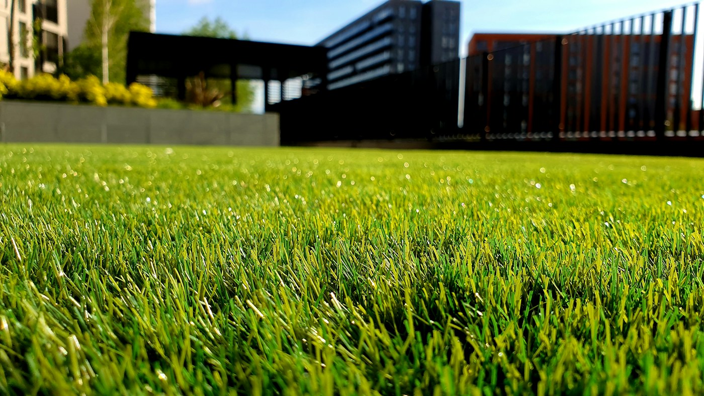 Finished landscaped property with lawn and planting beds